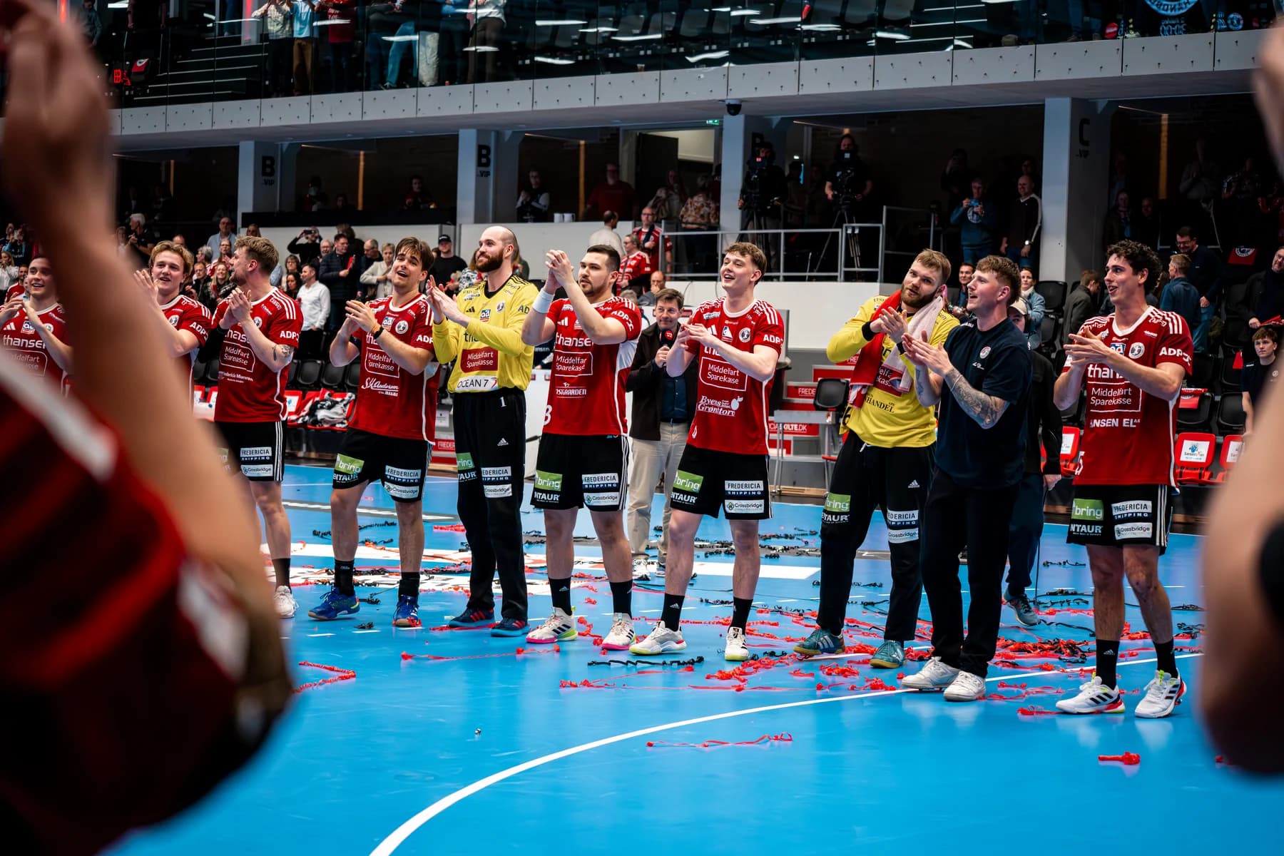 Fredericia Håndboldklub spillerportræt i aktion med klublogo på trøjen